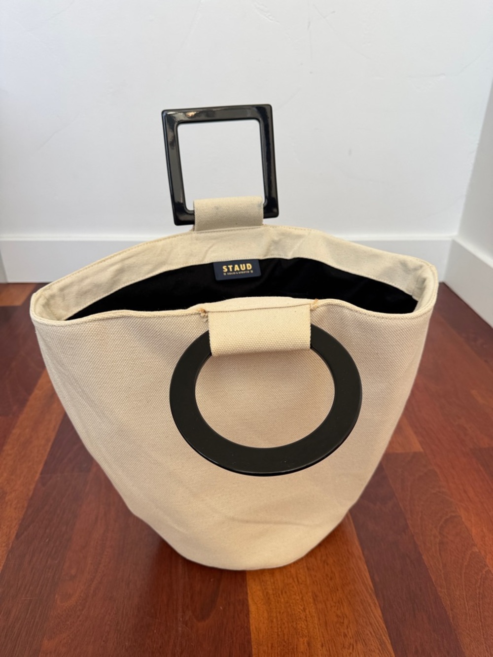 STAUD Shirley Cream Canvas Bucket Bag with Black Ring and Square Acrylic Handles
